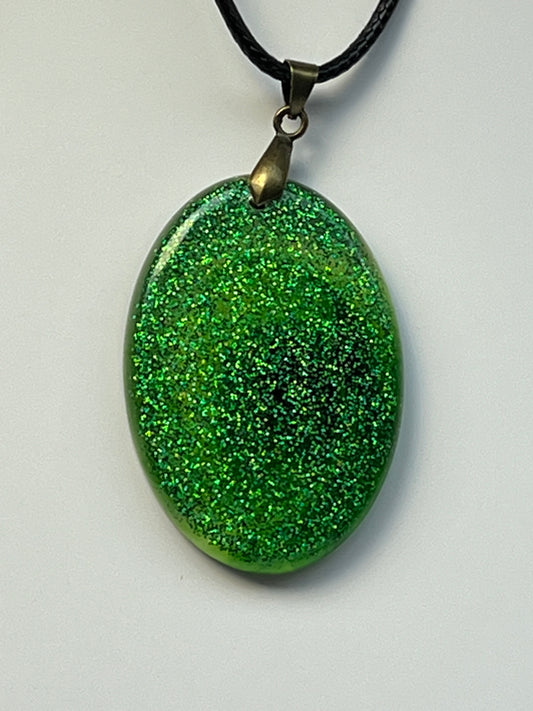 Emerald Vortex — Green Glitter Oval Resin Pendant