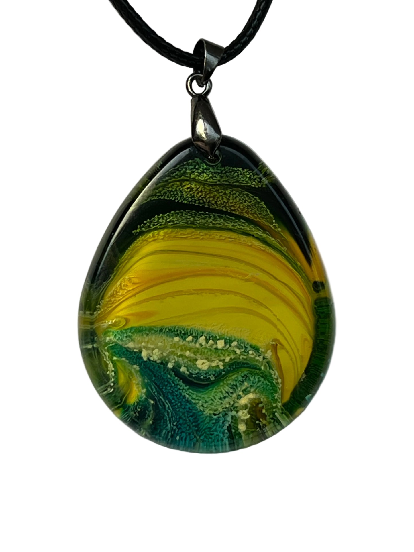 Handcrafted teardrop resin pendant with electric yellow ribbon stripes framed by deep forest green edges and a foamy teal and aqua textured base, suspended from a silver chain with a silver-toned bail.