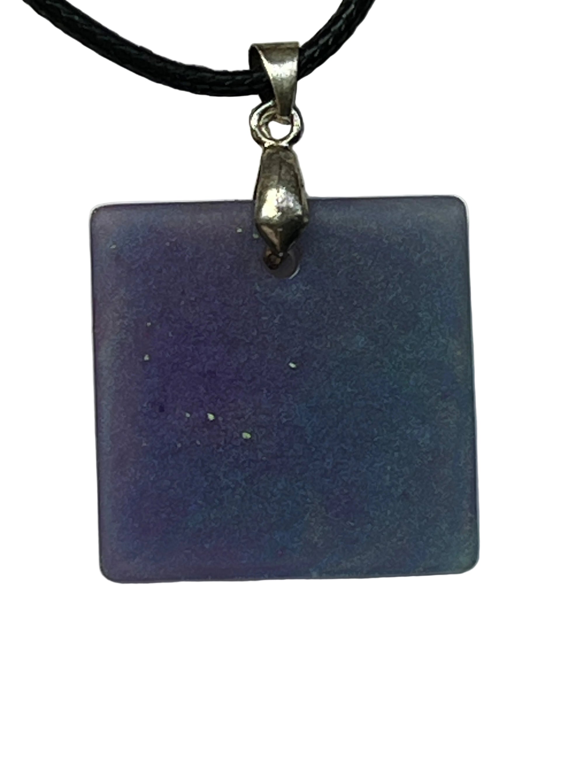 Handcrafted square resin pendant with swirling lavender, periwinkle, and steel blue shimmer and scattered gold and green glitter flecks, suspended from a black braided cord with a silver-toned bail.