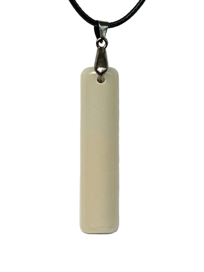 Handcrafted elongated bar resin pendant with creamy ivory and warm grey milky translucent finish with natural banding, suspended from a black braided cord with a silver-toned bail.