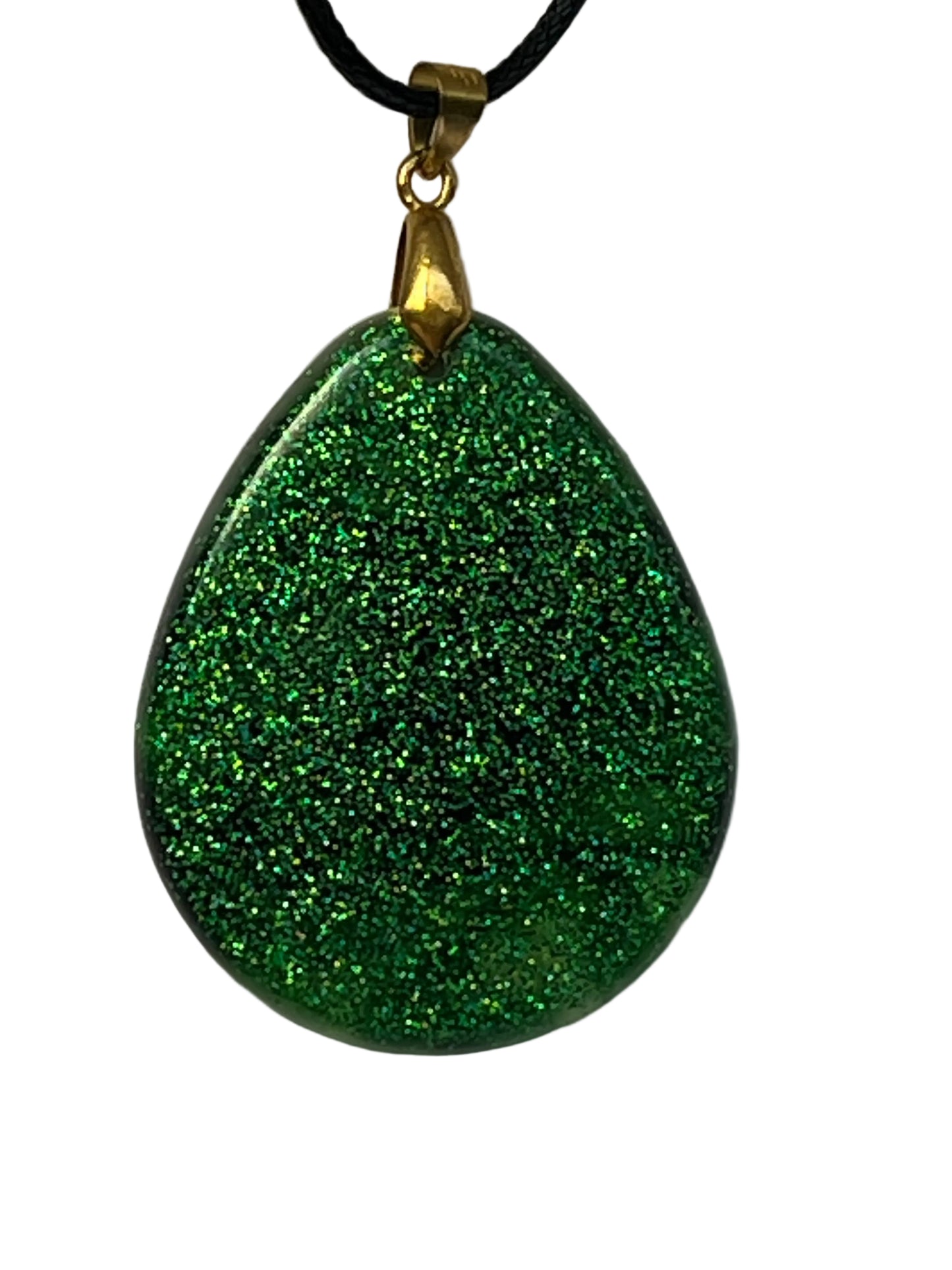 Handcrafted deep emerald green resin wide teardrop pendant packed with dense holographic glitter throughout, suspended from a black braided cord with a gold-toned bail.
