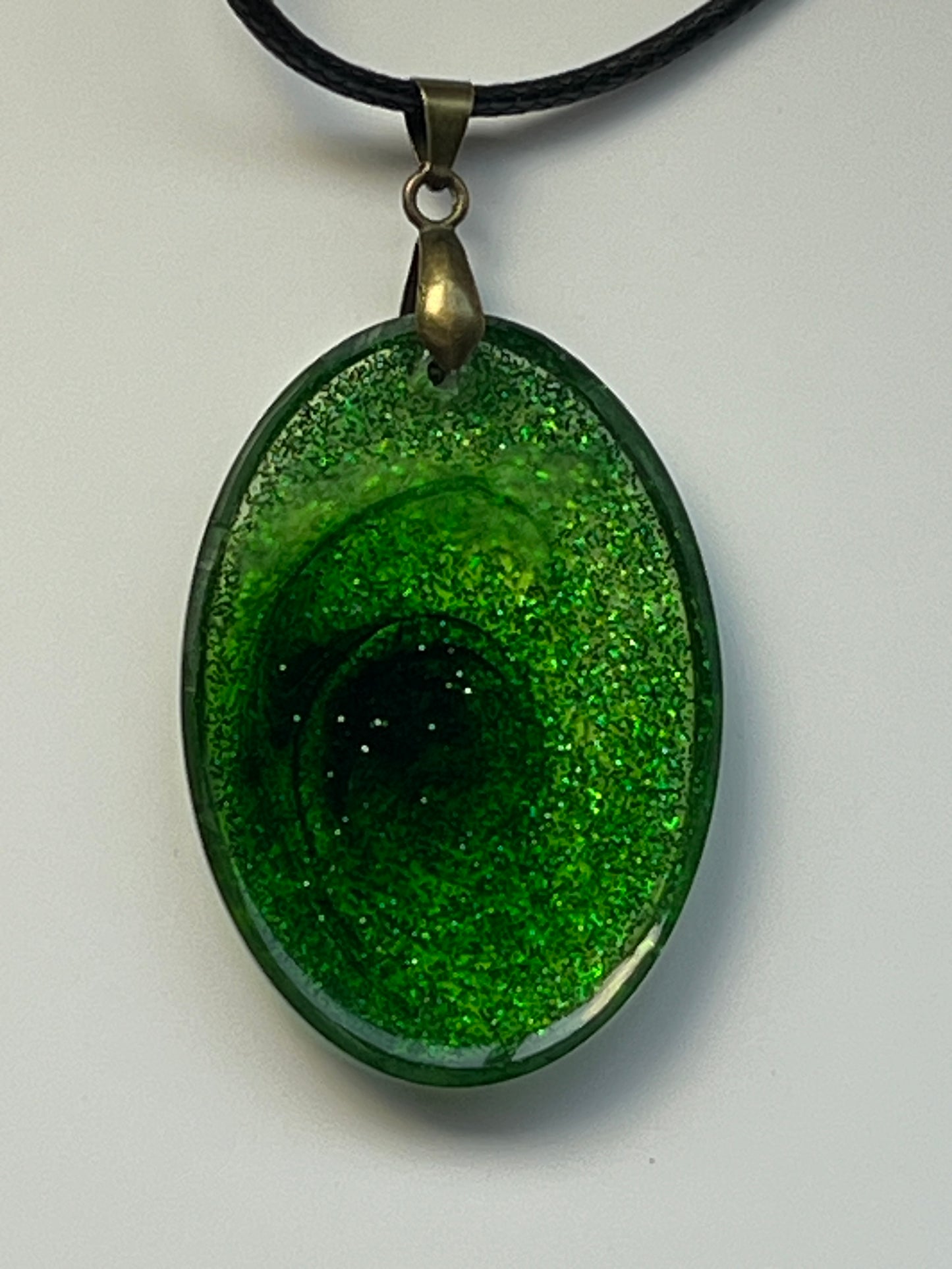 Emerald Vortex — Green Glitter Oval Resin Pendant