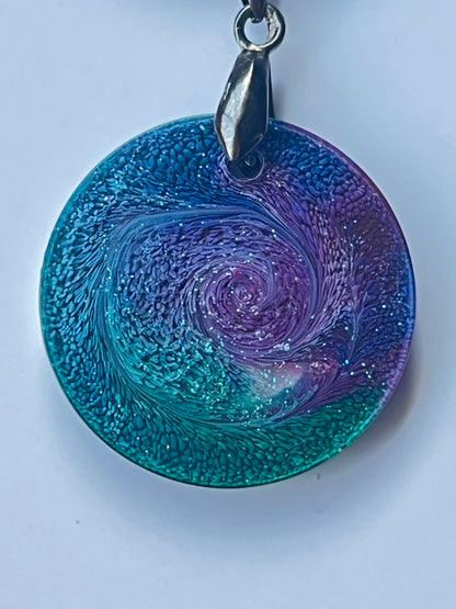 Starry Vortex — Teal & Violet Galaxy Resin Pendant