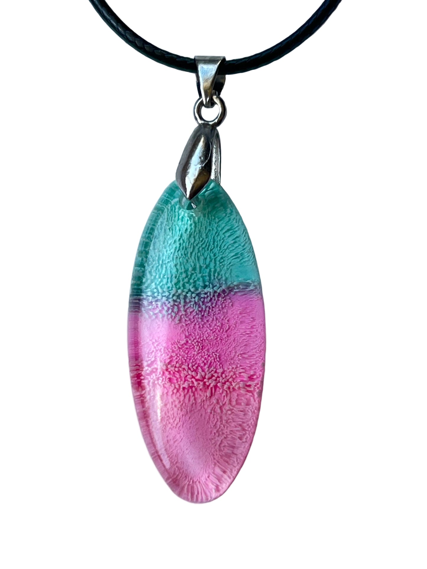 Handcrafted translucent teal and rose pink resin elongated marquise pendant with intricate fine cellular texture throughout and a soft lavender transition zone between the two colors, suspended from a black braided cord with a silver-toned bail.
