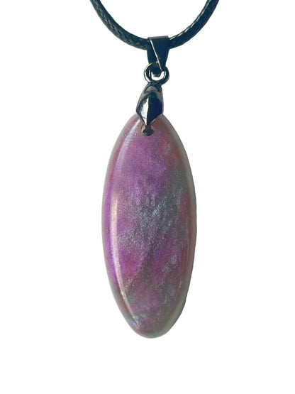 Handcrafted resin elongated marquise pendant in soft dusty violet and heather purple with organic sage green and pewter grey mineral cloud formations and fine pearlescent shimmer throughout, suspended from a black braided cord with a gunmetal bail.