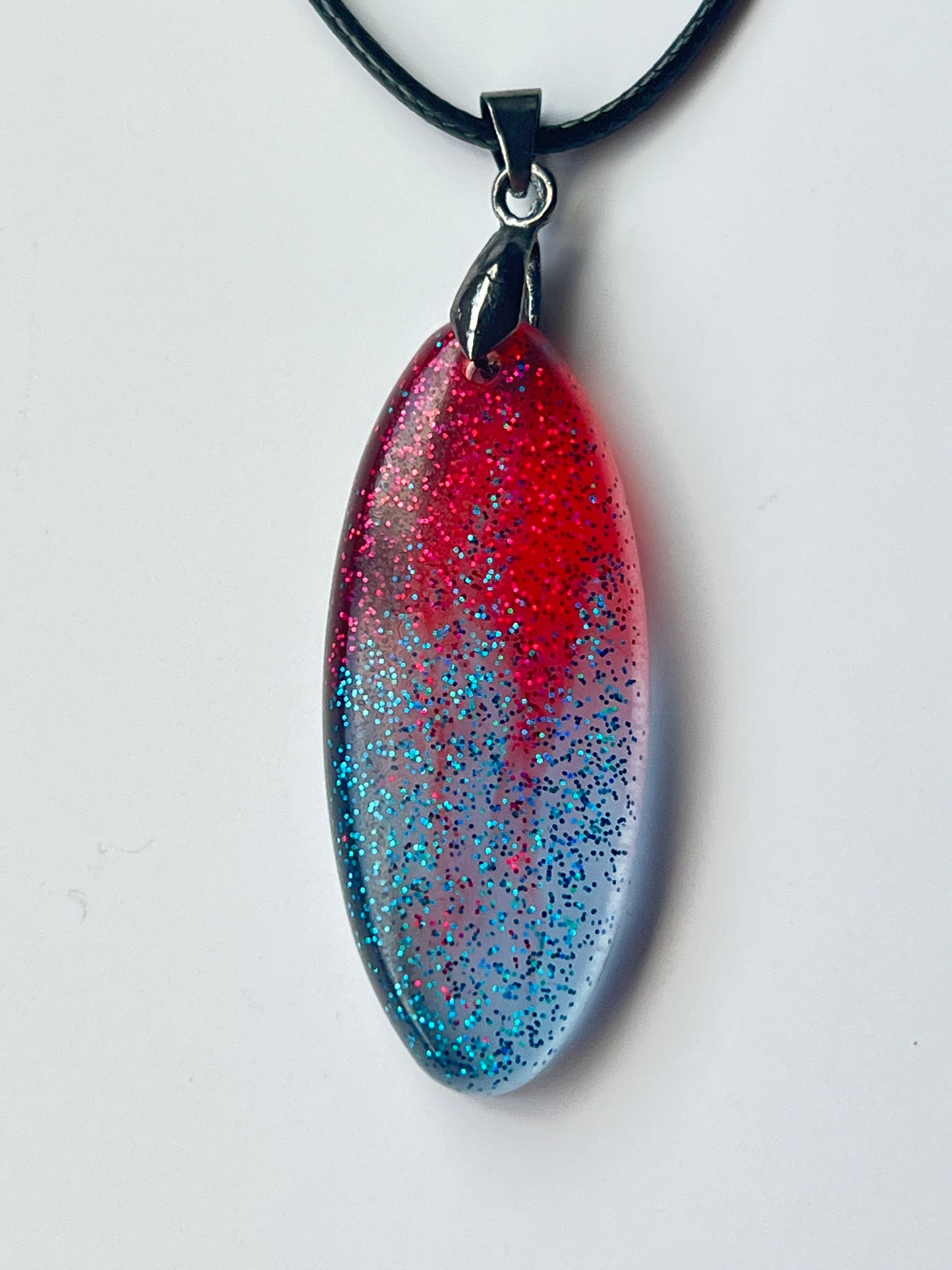 Stardust Requiem — Red & Silver Blue Glitter Resin Pendant