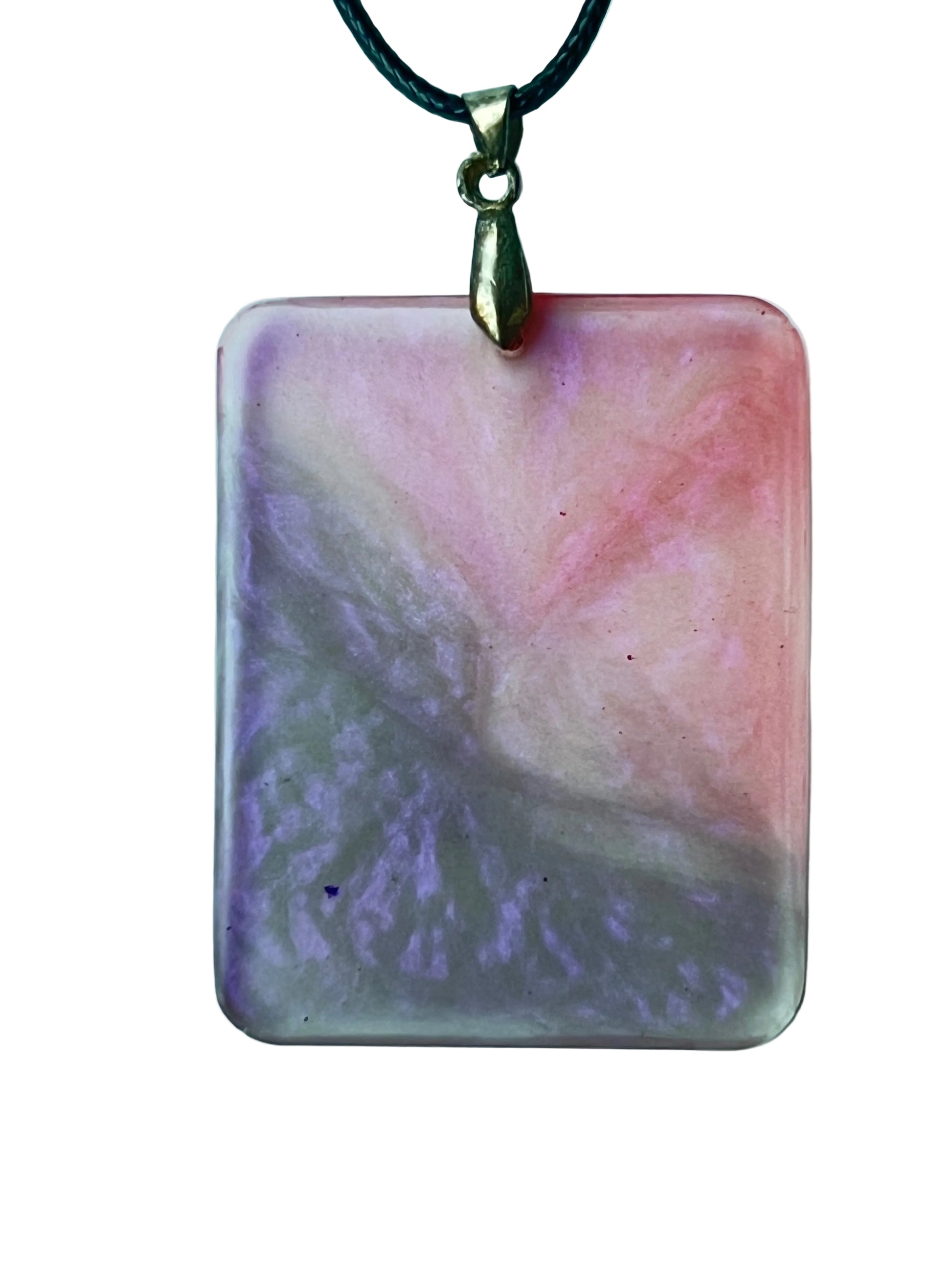 Handcrafted large resin rounded rectangle pendant with soft translucent blush and dusty rose upper right field meeting a complex swirling lavender-grey in a dramatic diagonal sweep with watercolor-like atmospheric blending throughout, suspended from a black braided cord with an antiqued brass bail.