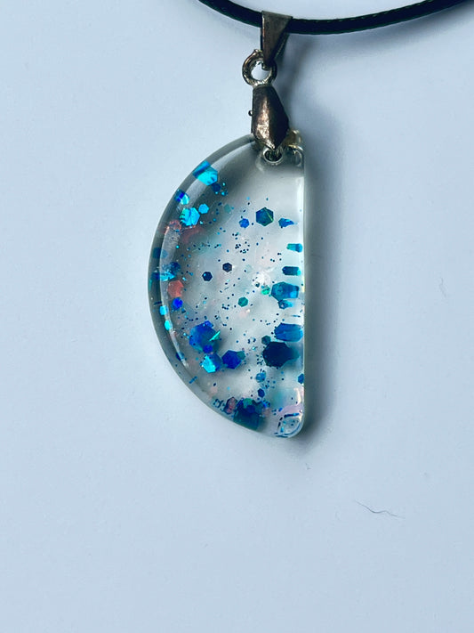 Blue Crystal Moon — Clear & Sapphire Glitter Half Moon Resin Pendant