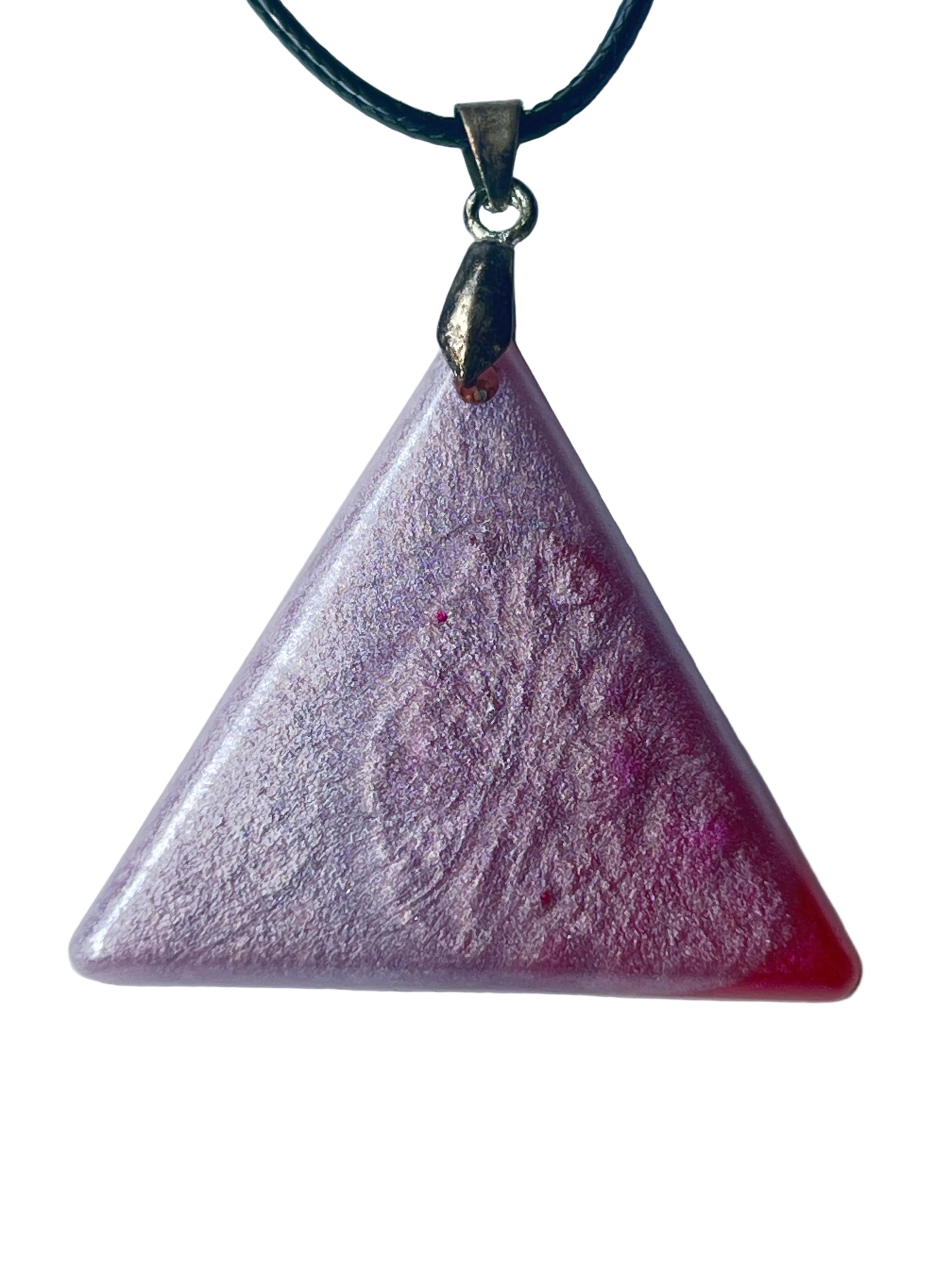 Handcrafted soft pearlescent lavender-rose resin equilateral triangle pendant with extraordinarily fine silver and pink mica shimmer throughout, subtle swirling organic texture, and a vivid translucent crimson accent at the lower right corner, suspended from a black braided cord with a silver-toned bail.
