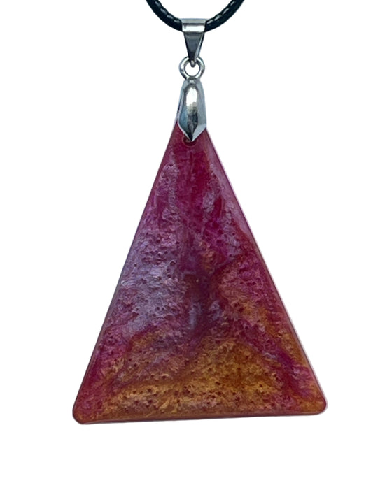 Handcrafted resin upward-pointing triangle pendant with a warm amber and burnt orange base graduating through coral and fuchsia to deep magenta at the apex, with pearlescent textured shimmer throughout, suspended from a black braided cord with a silver-toned bail.