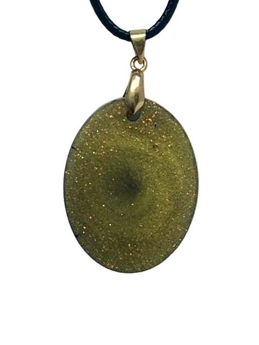 Handcrafted deep olive-gold resin oval pendant with dense fine copper, amber, and gold glitter throughout and a subtle darker olive swirl at the center, suspended from a black braided cord with a gold-toned bail.