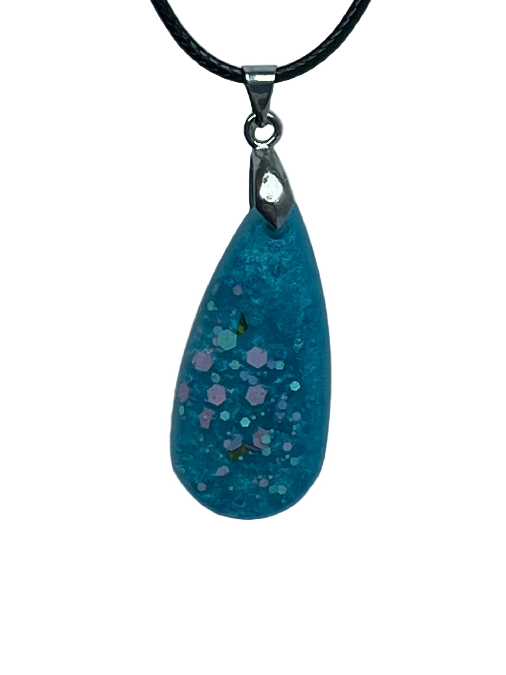 Handcrafted soft dusty teal resin long teardrop pendant with scattered hexagonal glitter pieces in soft blush pink and iridescent mint-teal, suspended from a black braided cord with a silver-toned bail.