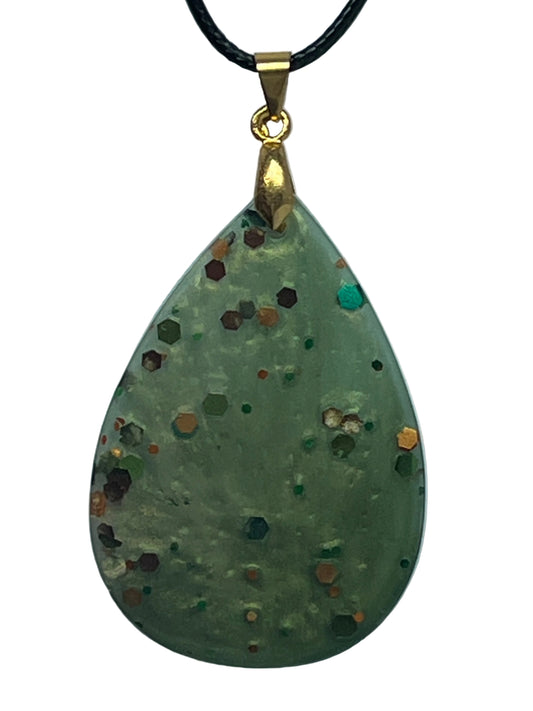 Handcrafted soft pearlescent sage green resin large teardrop pendant with bold scattered hexagonal glitter pieces in deep burgundy, burnt orange, copper, forest green, teal, and warm gold, suspended from a black braided cord with a gold-toned bail.
