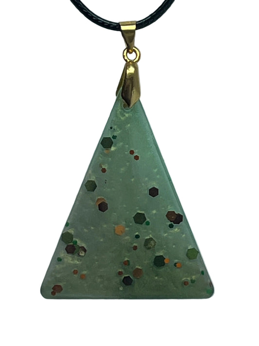 Handcrafted frosted semi-translucent celadon resin upward-pointing triangle pendant with bold scattered hexagonal glitter in deep burgundy, burnt orange, copper, and forest green, suspended from a black braided cord with a gold-toned bail.
