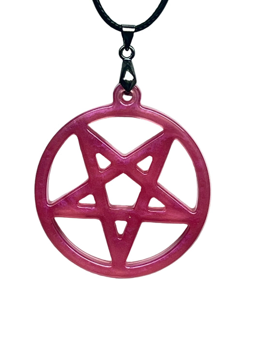 Handcrafted vivid fuchsia and deep rose pink resin large circle pendant with open cutwork inverted pentagram within an encircling ring and translucent blush interior windows, suspended from a black braided cord with a gunmetal bail.