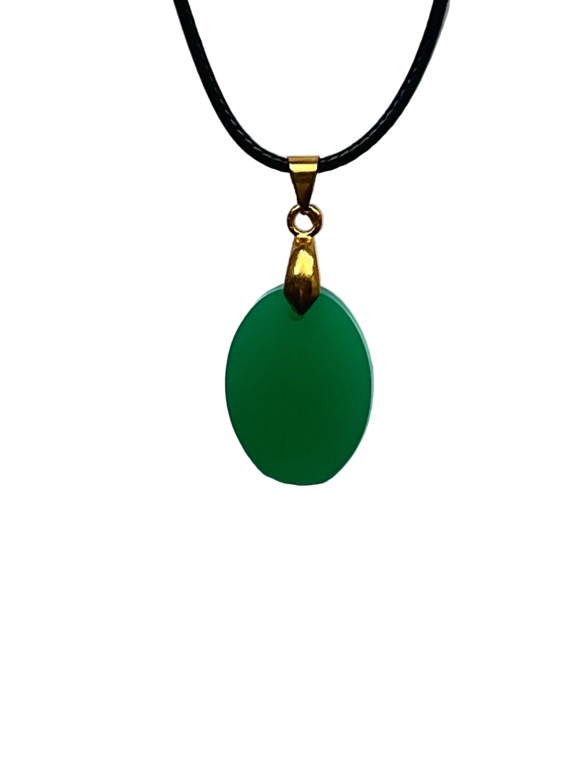 A smooth oval-shaped resin pendant in a solid, rich jade green with a soft luminous finish and no inclusions. It hangs from a gold-toned bail on a black braided cord against a pale background.