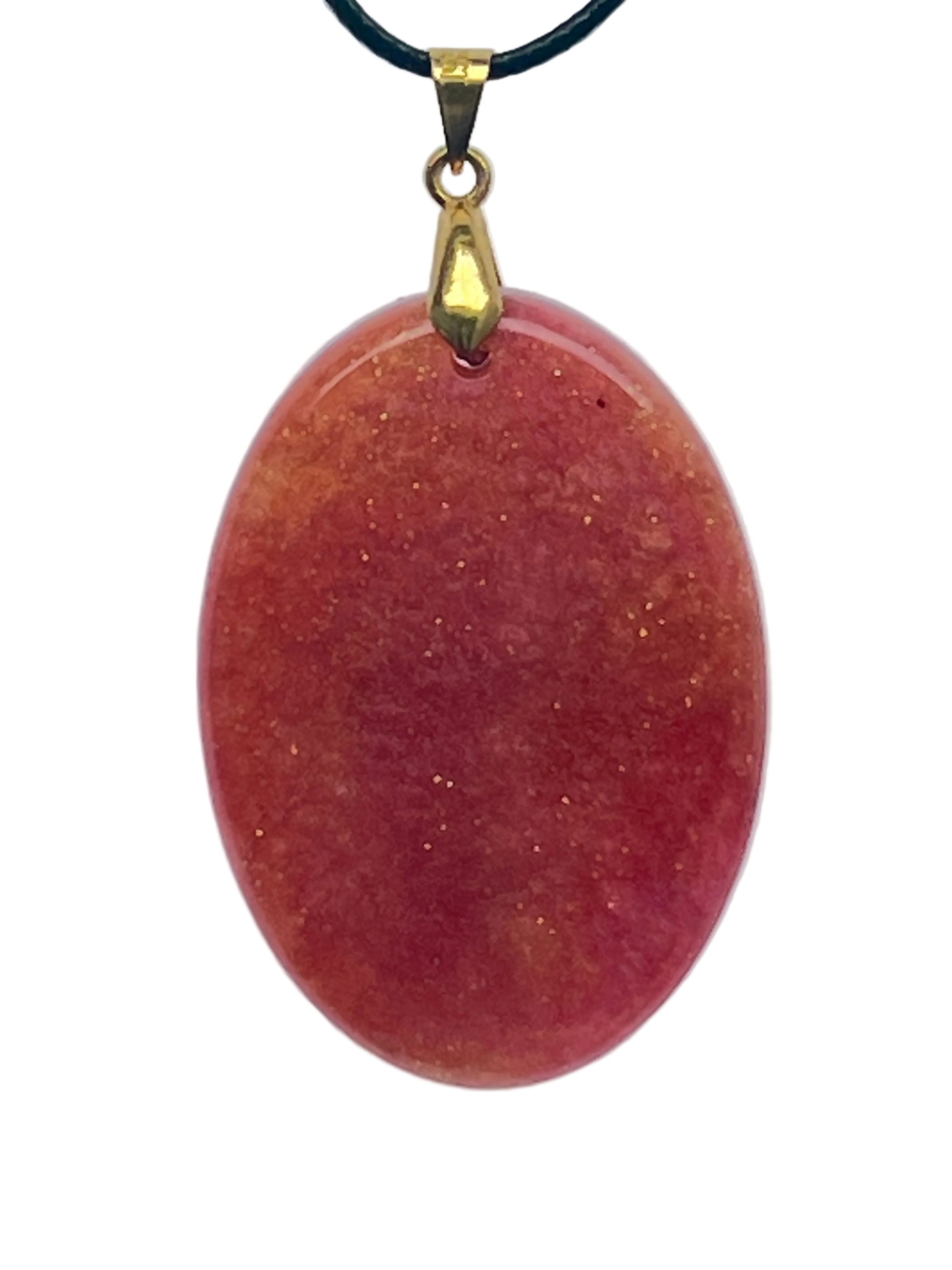 An oval-shaped resin pendant with a warm gradient of peach, coral, and terracotta rose, scattered throughout with fine gold sparkle flecks. It hangs from a gold-toned bail on a black braided cord against a pale background.