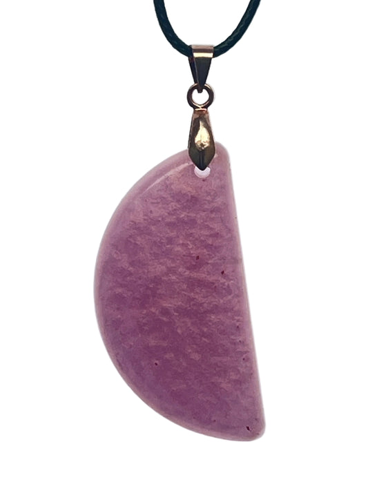 A gently curved half-moon shaped resin pendant in dusty mauve and violet with a soft, mottled, suede-like texture. It hangs from a rose gold bail on a black braided cord against a pale background.