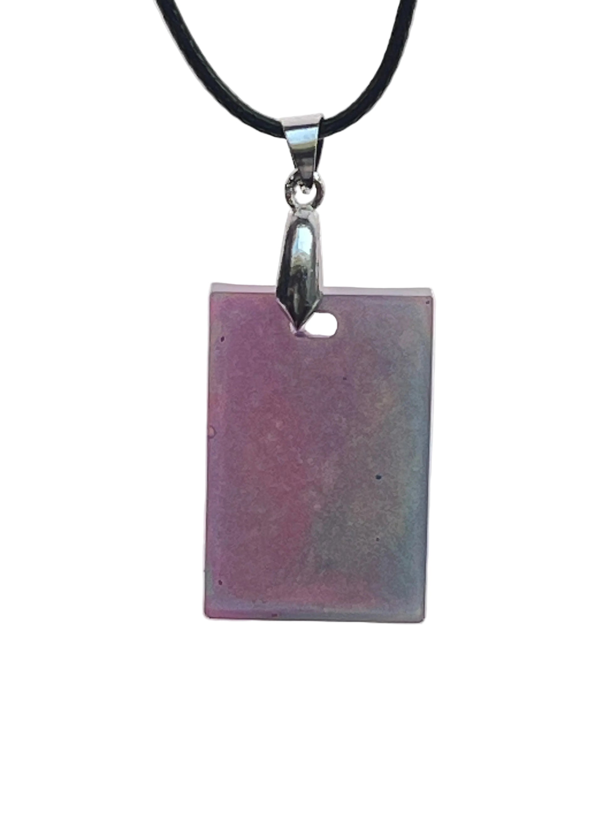 A rectangular resin pendant with a soft gradient from dusty mauve-pink on one side to pale sage-grey with iridescent shimmer on the other. It hangs from a gunmetal bail on a black braided cord against a pale background.